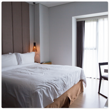 hotel-bedroom-with-double-bed-table-tv-set